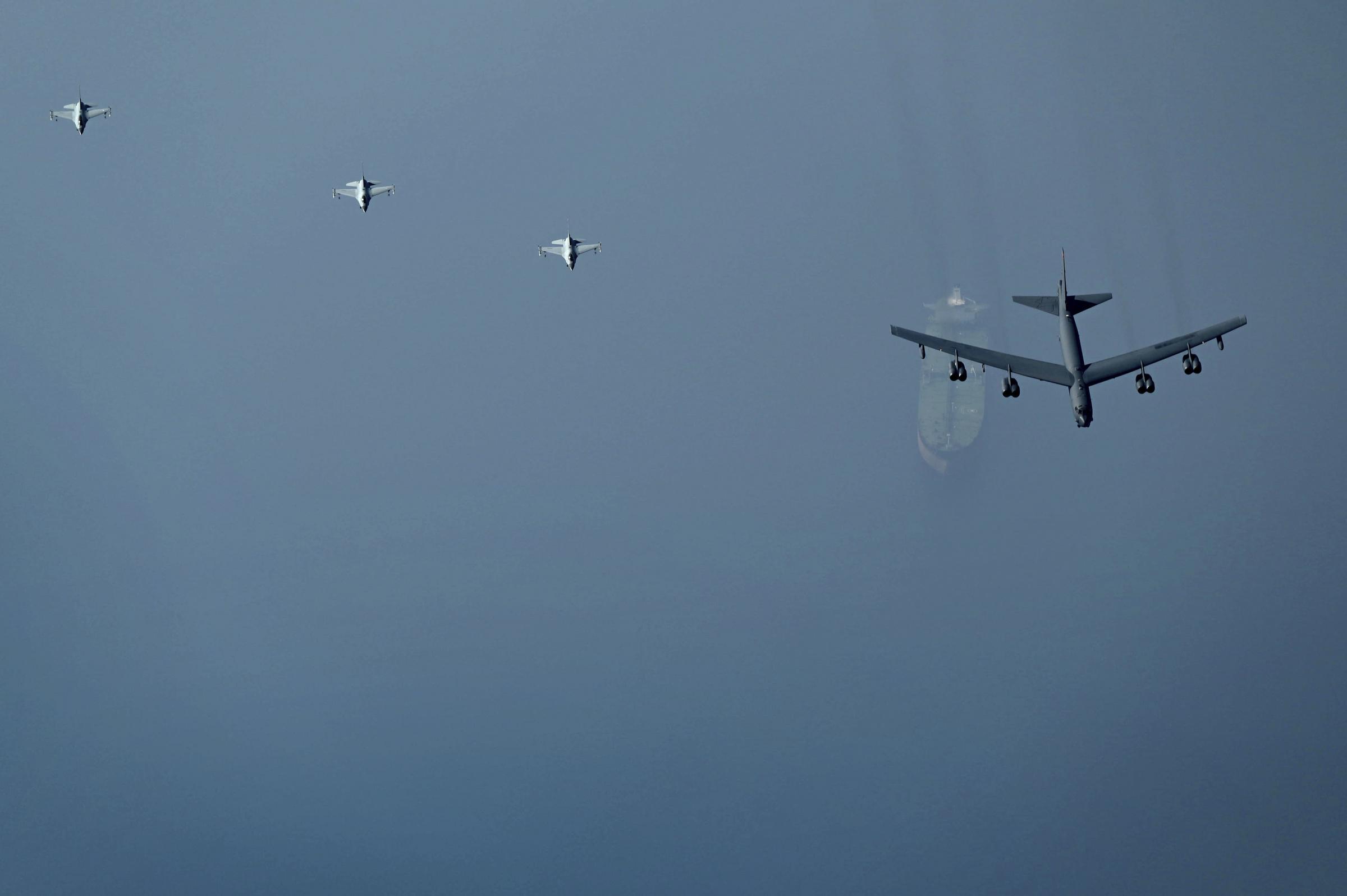 A B-52H Stratofortress assigned to the 5th Bomb Wing, Minot Air Force Base, North Dakota, flying over an oil tanker in the Middle East on Sunday. Picture: Staff Sgt. Charles Fultz/U.S. Air Force via AP 