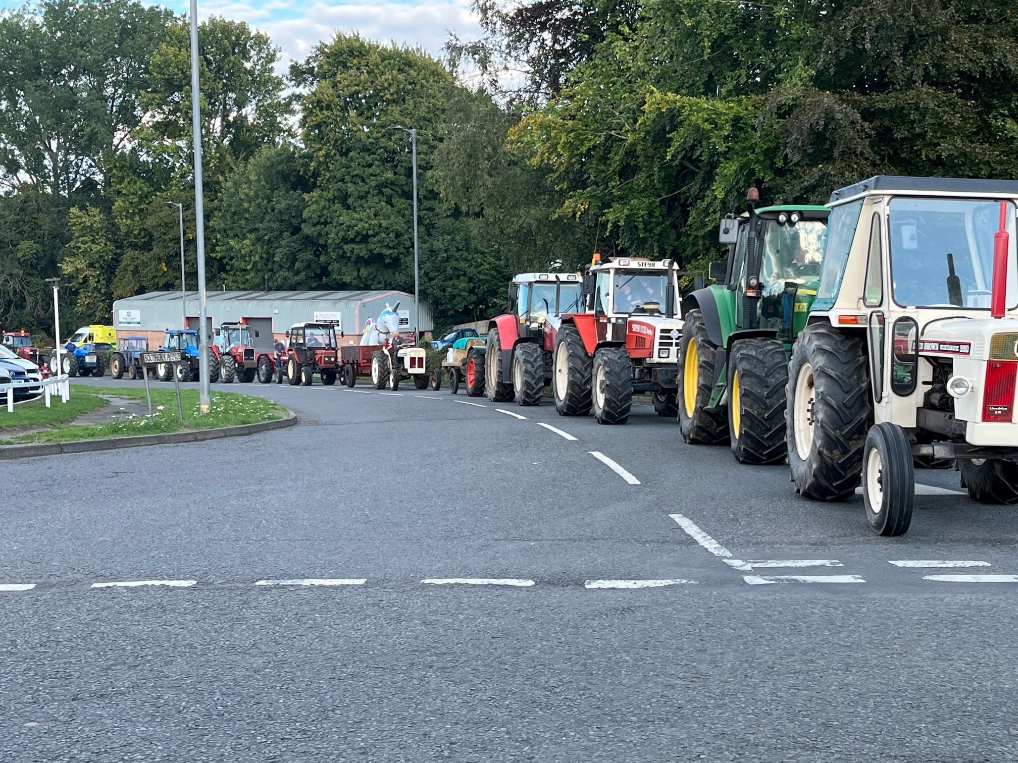 A parade of tractors take to the roads.