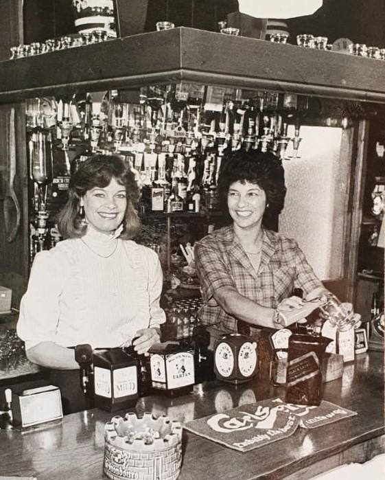 Hereford Times: Anne Eden and Margaret Hopkins behind the bar at the Royal Oak in 1986. Picture: Hereford Times