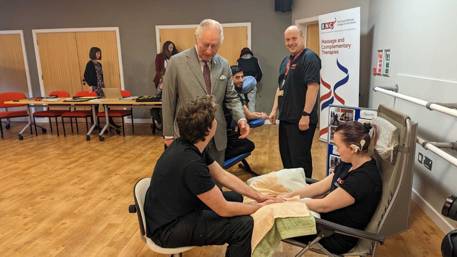King Charles visited the RNC in Hereford. Learning about massage from student Liam Wood