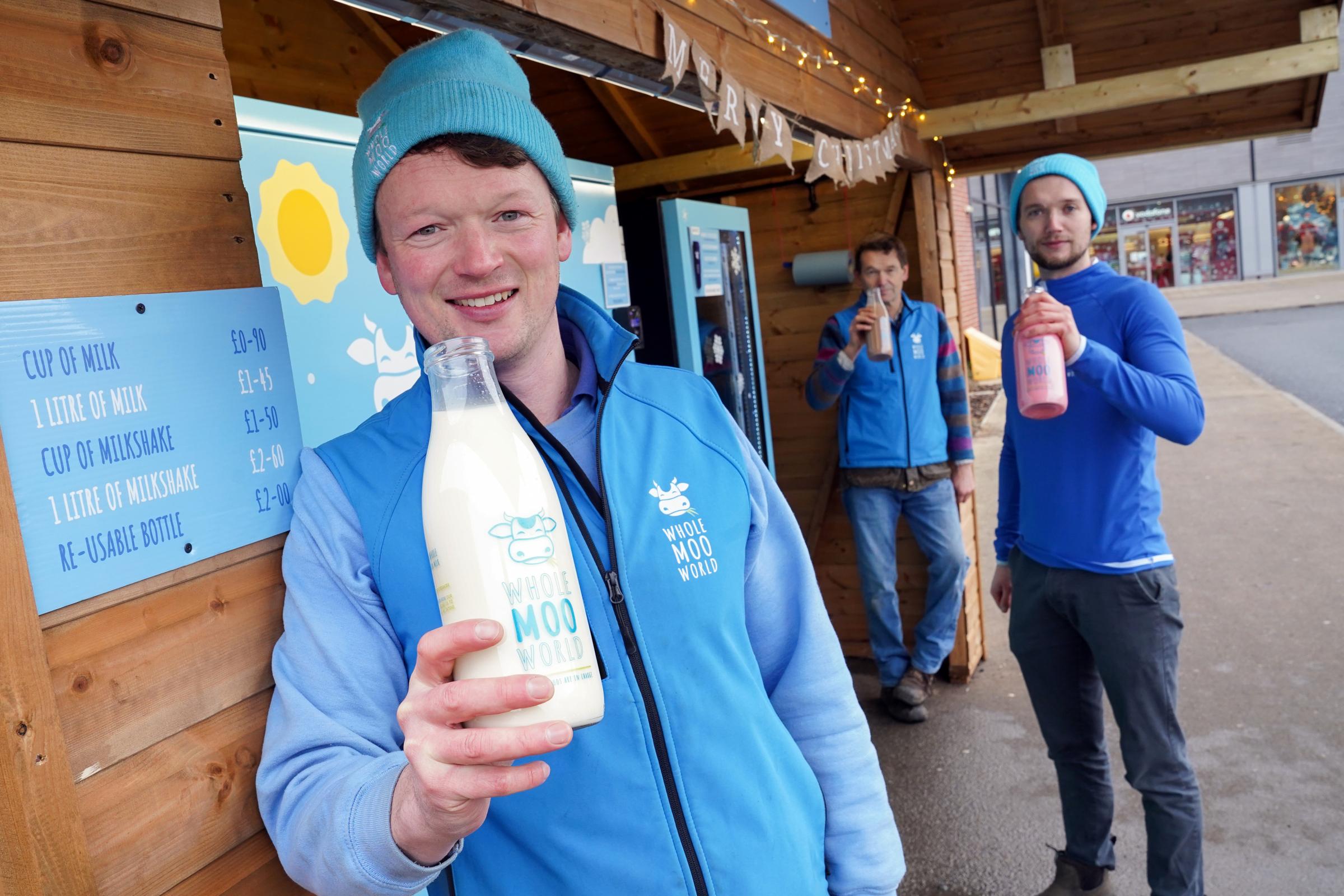 Excited owners at their new Whole Moo World milk vending machine at the Old Market in Hereford. From left, Sam, Mark and Jacob James.