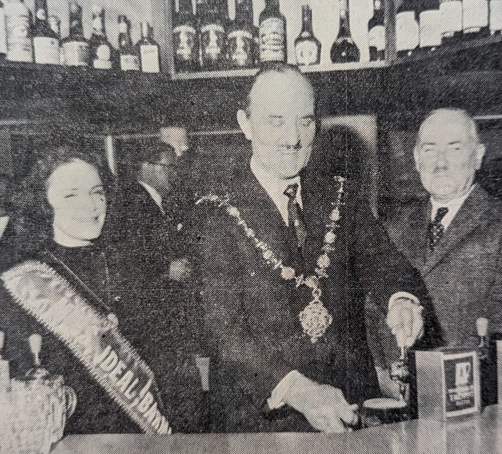 Mayor Ivor Williams (centre) with Sally Ann Turner, Whitbreads Ideal Barmaid of 1968, and Col J, Hill, Lord Lieutenant of Monmorth and Whitbread Flowers director at the new Kings Head in Broad Street, Hereford