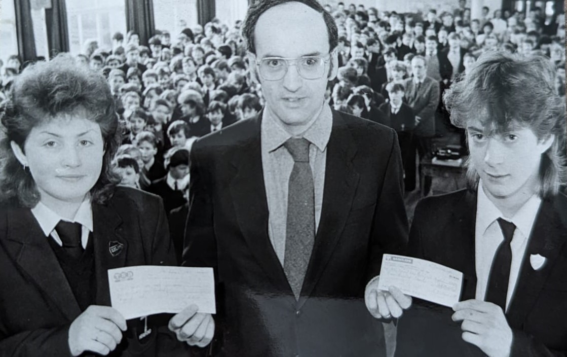 Whitecross 1987: Jane Morris and Dean Morris donate a cheque for the special care baby unit to Dr Andrew Butterfill