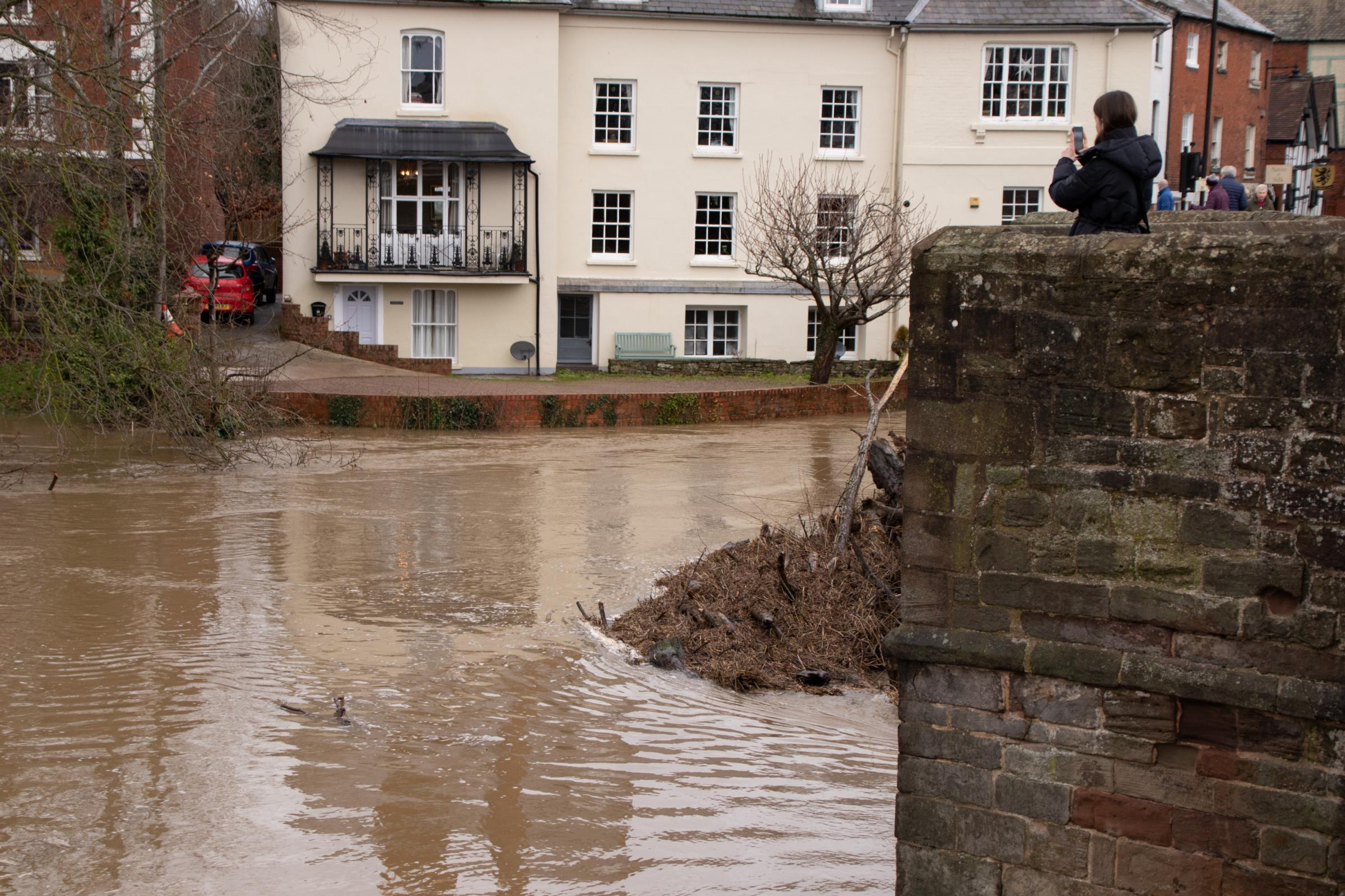 A swollen river Wye in Hereford on Sunday, January 8, with debris piled up against the Old Bridge . Picture: Sofie Smith.