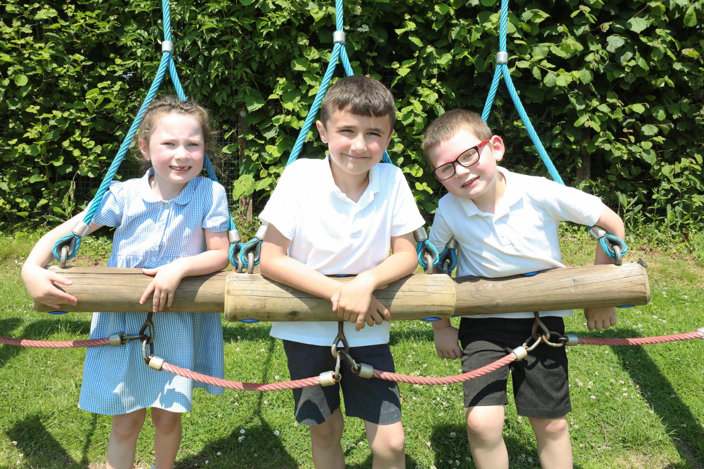 Year one pupils enjoying their time in the schools playground. (L-R) Adahna, Riley and Harvey.