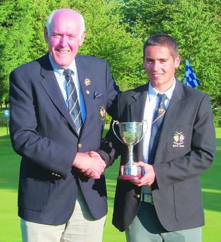 President of Shropshire & Herefordshire Union Roger Elston presents the Griffith Price Cup to Alex Allen for the best afternoon round.