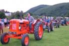 Some of the many tractors at the event going around the show ring.