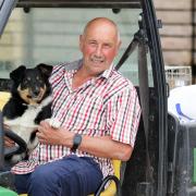 Roger Bowen has taken 'massive pride' working for Oakfields Farm over the past 54 years . Pictured here with his dog, Peg. Picture: Rob Davies