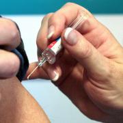 More than 12,000 people were vaccinated against coronavirus on Christmas Day, NHS figures have shown.