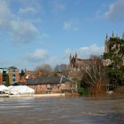 Flood barriers are in place at De Koffie Pot in Hereford as the Wye nears its peak this afternoon. Picture: Stuart Townsend