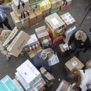 Volunteers prepare to load a van with donations for Ukrainian refugees, photo via PA.