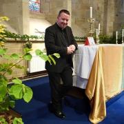 Ben Griffith, Reverend of Kington Parish Church, with one of the displays     Picture: Andy Compton