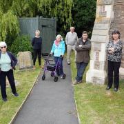 Supporters at the outside toilet which has caued dispute over its positioning at St Matthew church in Marstow. Picture: Rob Davies
