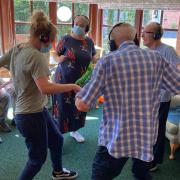 Staff and residents enjoying a 'silent disco' at Forbury Care Home in Leominster.   Picture: Forbury Care Home