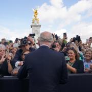 King Charles III is greeted by well-wishers during a walkabout to view tributes left outside Buckingham Palace, London, following the death of Queen Elizabeth II on Thursday.