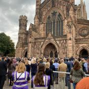 For the first time at a substantial gatherin gin Herefordshire crowds sing the National Anthem with the words God save the King as Charles is proclaimed monarch at Hereford Cathedral. Picture: Hattie Young