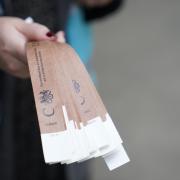 A marshall holds wristbands at the end of the queue near Tower Bridge, London. Picture: PA Wire