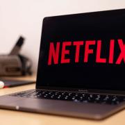 Netflix to charge users for password sharing in early 2023 (Canva)