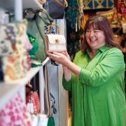 Sarah Rabone with one of the many handbags on sale at her newly opened gift shop in Hay-on-Wye. Picture: Rob Davies