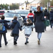 A school near Hereford has been visited by Ofsted as it checks to see if it is still good.
Schoolchildren walking to school. Pupils hand in hand with their mum.  Stock picture: PA Wire