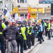 Protesters join a protest organised by far-right group Patriotic Alternative, during a demonstration, outside the Beresford Hotel in Newquay, Cornwall, which houses refugees