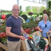Hereford Times reader John Lindsay from Holme Lacy collects his prize from Beccy Hawkins in the garden centre at Oakchurch Farm Shop.