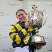 : Lucy Turner celebrates victory aboard Chambard at Aintree over the world-famous Grand National fences