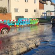A burst water main resulted in a large puddle in Roman Road, Hereford