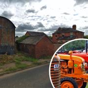 The Dutch barn and storage buildings that will be pulled down to make way for the shed and inset, vintage tractors on display