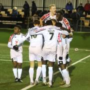 Hereford players celebrate the game’s only goal as they beat Rushall Olympic 1-0