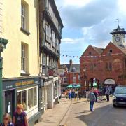 11 High Street, currently pale yellow, lies in the heart of the Ross-on-Wye conservation area