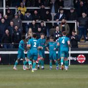 Chorley players celebrate Jack Hazelhurst’s 16th minute winner in front of the Meadow End