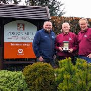 Edward Goddard presenting Les Preedy with watch. From left to right: previous owner Wayne Jones, Les Preedy, and Morris Leisure MD Edward Goddard
