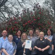 Staff at Hazlehurst Nursing Home with their award from carehome.co.uk