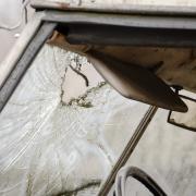 Burglars broke a vehicle's window with a hammer after breaking into a garage