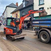 Clearing a 'beach' caused by washed-away builder's sand in Ross-on-Wye