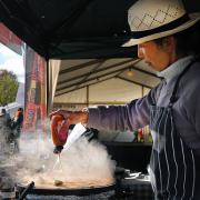 Pancakes with world flavourings being made on the Castle Green.