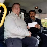 Taxi driver Mohammed Nisar and Herefordshire motor trader, Adrian Quinn, who are now friends for life. Photo: CATERS NEWS.