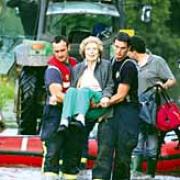 Mary McHarg is rescued by firefighters. Picture by Ray Lloyd.