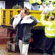 6Jesse Norman helps out with the sandbag defences in Newtown Road, Hereford