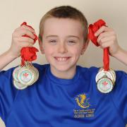 Oliver Jones won 13 gold medals and a silver medal at the South East Wales Swimming Championships. Photo: James Maggs