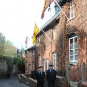 Harry and Oliver Daw beneath the flags in Hereford's Gwynne Street