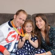 Paralympic swimmer, seen here with his wife Nyree and daughter Ella, has decided to retire from the sport