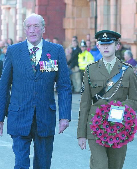 The Vice Lord Lieutenant Sir John Foley KCB OBE MC DL with cadet at Hereford's Remembrance parade. Picture by Eye Contact Media.