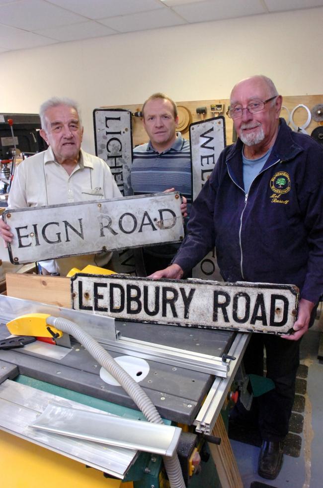 Repairing streets signs – and saving the taxpayer cash – are Tony Archer, Councillor Jim Kenyon and Mel Russell. Picture by James Maggs.