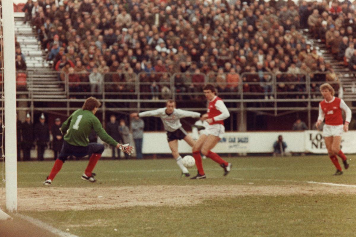Hereford United defender Chris Price scores against Arsenal in the 1-1 F.A. Cup Third Round tie at Edgar Street.