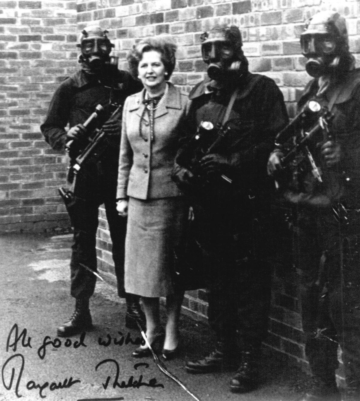 PM Margaret Thatcher outside 'The Killing House' with members of the SAS SP Team at their Stirling Lines HQ in Hereford.