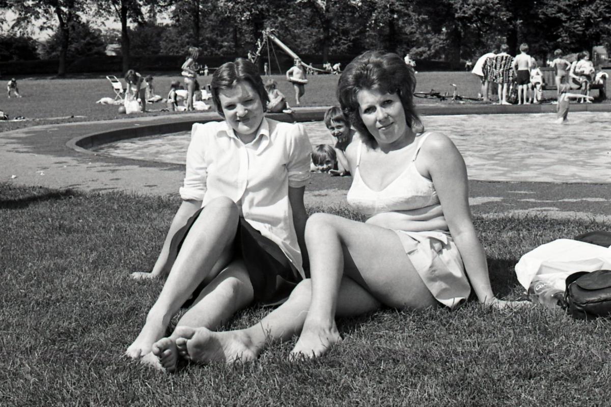 Sunbathers next to the paddling pool on King George V playing fields in Hereford. 5th August, 1974.