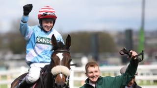 Jockey Stan Sheppard celebrates on board Cruz Control in the three-mile William Hill Handicap Steeple Chase at Aintree