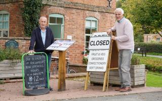 Volunteers Phil Milchard, left, and David Wallis outside the Eardisland village shop. Picture: Rob Davies